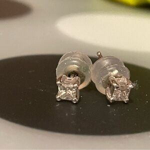Chic princess cut silver stud earrings set. Two earrings total.
